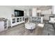 Open-concept living area with a modern kitchen, dining space, and a comfortable seating area at 500 W Respite Ln, Summerville, SC 29483
