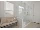 Modern shower with glass enclosure, white tiling, and a window for natural light at 500 W Respite Ln, Summerville, SC 29483