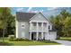 Charming two-story home with a welcoming front porch, lush green lawn, and attached garage at 553 Richfield Way, Summerville, SC 29486