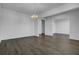 Spacious living room featuring hardwood floors and a stylish chandelier at 553 Richfield Way, Summerville, SC 29486