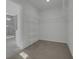 Carpeted walk-in closet with wire shelving and access to the primary bathroom at 553 Richfield Way, Summerville, SC 29486
