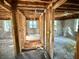 Exposed beams, an unfinished bathroom, and the home's original framing shows the potential for a modern renovation at 5901 Sedgefield Dr, Hanahan, SC 29410
