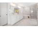 Bright bathroom with double vanity, marble floors and backsplash, a soaking tub, and glass enclosed shower at 606 Dunswell Dr, Summerville, SC 29486
