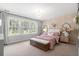 Bright bedroom with large windows, floral wallpaper, and crystal chandelier at 606 Dunswell Dr, Summerville, SC 29486