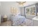 Bright bedroom featuring neutral walls and a white and blue floral patterned bed at 606 Dunswell Dr, Summerville, SC 29486