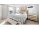 Bright, airy bedroom with a wood bed frame and neutral accents at 606 Dunswell Dr, Summerville, SC 29486