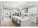 Bright modern kitchen featuring an oversized island, quartz countertops and stainless appliances at 606 Dunswell Dr, Summerville, SC 29486