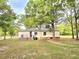 Side exterior view of a home featuring a wooden deck and a metal roof at 620 Coral Acres Dr, Moncks Corner, SC 29461