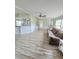 Open-concept living room with modern flooring, neutral tones, and a cozy seating area at 620 Coral Acres Dr, Moncks Corner, SC 29461