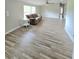 Bright living room with neutral walls, stylish floors, and a comfortable sofa at 620 Coral Acres Dr, Moncks Corner, SC 29461