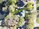 Aerial view showcasing a home with lush green lawn near a pond surrounded by trees at 739 Stiles Dr, Charleston, SC 29412