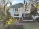 Back exterior view showcasing a two-story home, patio, deck, and landscaped yard with trees at 739 Stiles Dr, Charleston, SC 29412