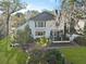 An aerial perspective reveals the back of the home, a brick patio, and artfully landscaped garden at 739 Stiles Dr, Charleston, SC 29412