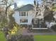 Back exterior view showcasing a two-story home, patio, deck, and landscaped yard with trees at 739 Stiles Dr, Charleston, SC 29412