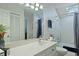 Bright bathroom with a large vanity, an oversized mirror, and a tub/shower combo at 739 Stiles Dr, Charleston, SC 29412
