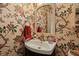 Powder room featuring beautiful floral wallpaper, vanity mirror, and vessel sink at 739 Stiles Dr, Charleston, SC 29412