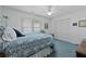 Cozy bedroom featuring a blue and white bedspread, a ceiling fan, and closet space at 739 Stiles Dr, Charleston, SC 29412