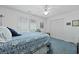 Bright bedroom with natural light, a ceiling fan, a blue bedspread, and closet space at 739 Stiles Dr, Charleston, SC 29412