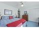 Cozy bedroom featuring blue floral bedding, complementary furnishings, and a ceiling fan at 739 Stiles Dr, Charleston, SC 29412
