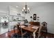 Classic dining room with wooden table, hardwood floors, chandelier, and sideboard at 739 Stiles Dr, Charleston, SC 29412