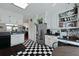 The spacious kitchen features bright white cabinets, black and white floors and stainless steel appliances at 739 Stiles Dr, Charleston, SC 29412