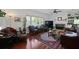 Cozy living room features hardwood floors, a fireplace, and lots of natural light at 739 Stiles Dr, Charleston, SC 29412