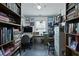Well-organized office space with built-in bookshelves, an office desk, and natural light at 739 Stiles Dr, Charleston, SC 29412
