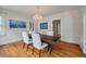 Bright dining room featuring wood floors, elegant lighting, and easy access to other living spaces at 798 Rutledge Ave, Charleston, SC 29403