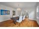 Open dining room with hardwood flooring and elegant decor connecting to the living room at 798 Rutledge Ave, Charleston, SC 29403