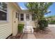 Charming front entrance with painted steps, mature landscaping and accent brickwork leading to the front door at 798 Rutledge Ave, Charleston, SC 29403