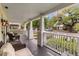 Relaxing front porch area with comfortable seating and a view of the neighborhood at 798 Rutledge Ave, Charleston, SC 29403