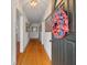 Entryway with hardwood floors and a decorative wreath on the front door at 798 Rutledge Ave, Charleston, SC 29403