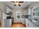 Modern kitchen featuring stainless steel appliances, granite countertops, and white cabinets at 798 Rutledge Ave, Charleston, SC 29403