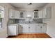 Updated kitchen with white cabinets, granite countertops and stainless steel appliances at 798 Rutledge Ave, Charleston, SC 29403