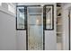 The bathroom is modernized with sleek black and white tiled shower and practical built in storage at 798 Rutledge Ave, Charleston, SC 29403