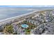 Luxury community with beachfront access, complemented by lush landscaping and a community pool at 9000 Palmetto Dr # 202-C, Isle of Palms, SC 29451