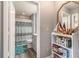 Bathroom features a walk-in shower with modern fixtures and shelving unit at 9000 Palmetto Dr # 202-C, Isle of Palms, SC 29451