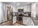 Modern kitchen equipped with stainless steel appliances, ample counter space, and white cabinets at 9000 Palmetto Dr # 202-C, Isle of Palms, SC 29451