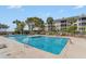 Inviting community pool with lounge chairs perfect for relaxation at 9000 Palmetto Dr # 202-C, Isle of Palms, SC 29451