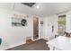 Light-filled room with beachy decor, white shiplap walls, and neutral flooring at 9000 Palmetto Dr # 202-C, Isle of Palms, SC 29451