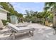 Backyard with a sand area, fire pit, lounge chairs, and a shed for outdoor relaxation and entertainment at 939 Mikell Dr, Charleston, SC 29412