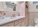 Unique bathroom showcasing vintage pink tiling, a decorative mirror and ample counter space at 939 Mikell Dr, Charleston, SC 29412