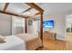 Spacious bedroom features a decorative four-poster bed, hardwood floors, and ample natural light at 939 Mikell Dr, Charleston, SC 29412