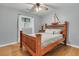Cozy bedroom featuring hardwood floors, a sailboat decoration, and a comfortable-sized bed at 939 Mikell Dr, Charleston, SC 29412