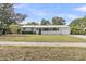Charming single-story home with a welcoming front porch and well-maintained lawn at 939 Mikell Dr, Charleston, SC 29412