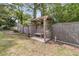 Picturesque backyard featuring a gazebo with a bench, offering a tranquil outdoor retreat at 939 Mikell Dr, Charleston, SC 29412