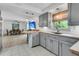 Updated kitchen featuring gray cabinets, butcher block countertops, and modern stainless steel appliances at 939 Mikell Dr, Charleston, SC 29412