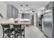 Spacious kitchen with gray cabinets, butcher block countertops, a kitchen island, and stainless steel appliances at 939 Mikell Dr, Charleston, SC 29412