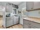 Kitchen features gray cabinets, granite countertops, and stainless steel appliances at 939 Mikell Dr, Charleston, SC 29412