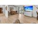 Open living room area with modern floors, a dining table, and access to the outdoor living space at 939 Mikell Dr, Charleston, SC 29412